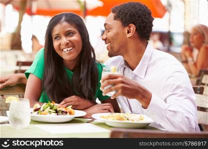Couple Enjoying Lunch In Outdoor Restaurant