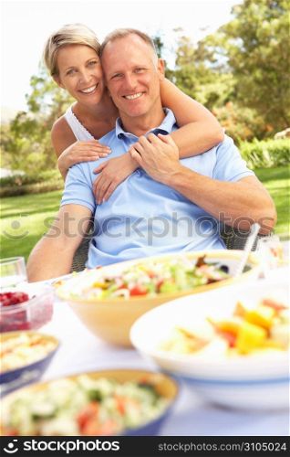 Couple Enjoying Meal In Garden