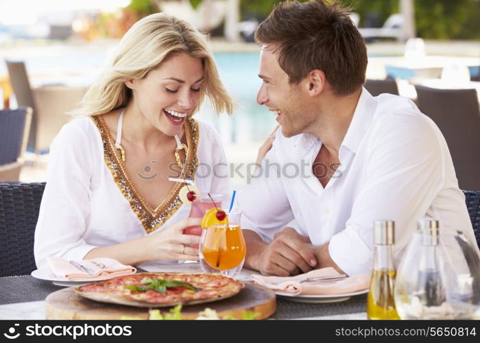 Couple Enjoying Meal In Outdoor Restaurant