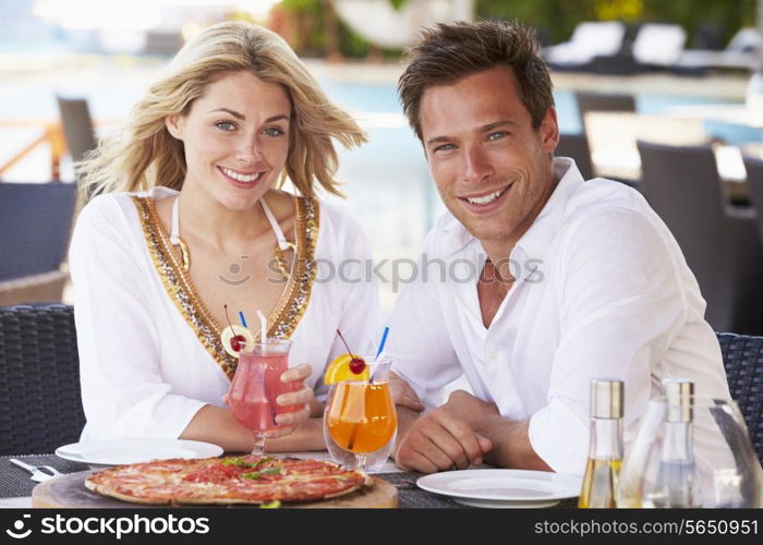 Couple Enjoying Meal In Outdoor Restaurant