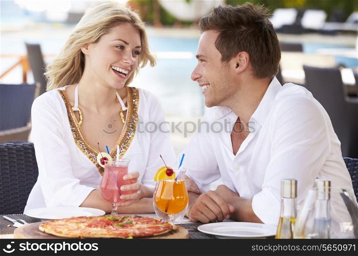 Couple Enjoying Meal In Outdoor Restaurant