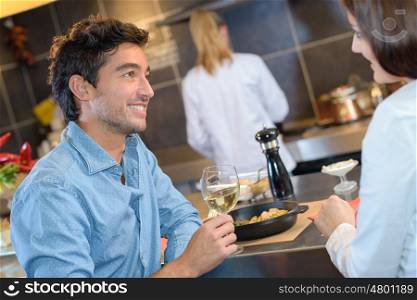 Couple enjoying meal in restaurant
