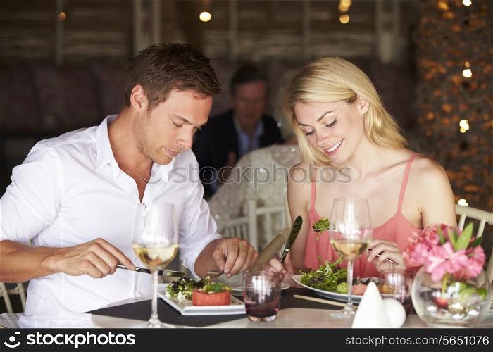 Couple Enjoying Meal In Restaurant
