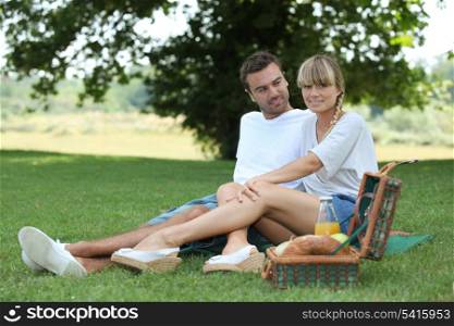 Couple enjoying picnic in the park