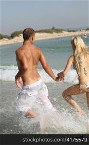 Couple enjoying themselves on the beach