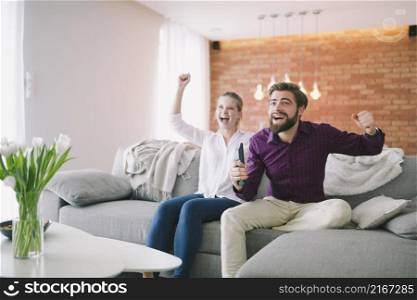 couple enjoying tv couch