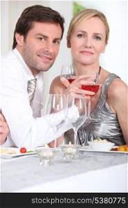 couple enjoying wine with dinner