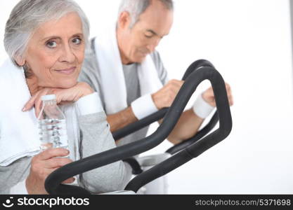 Couple exercising together at the gym