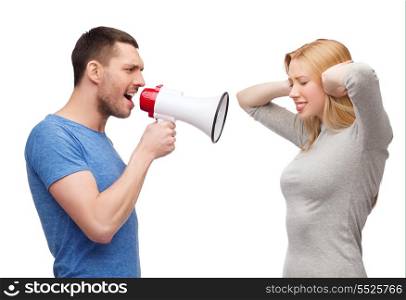 couple, family and relationship problems concept - boyfriend screaming though megaphone at his girlfriend