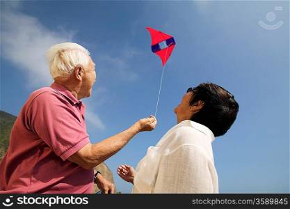 Couple Flying Kite Together