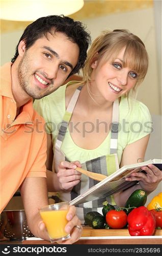 Couple following a recipe