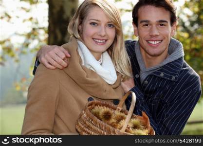 Couple gathering chestnuts