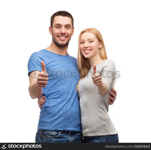 couple, gesture and family concept - smiling couple showing thumbs up