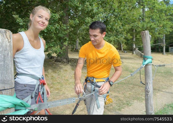 couple getting ready for the rope park