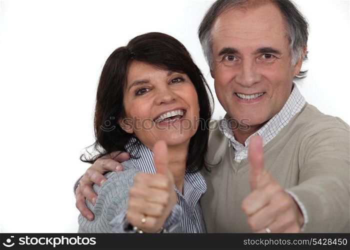 Couple giving the thumbs-up