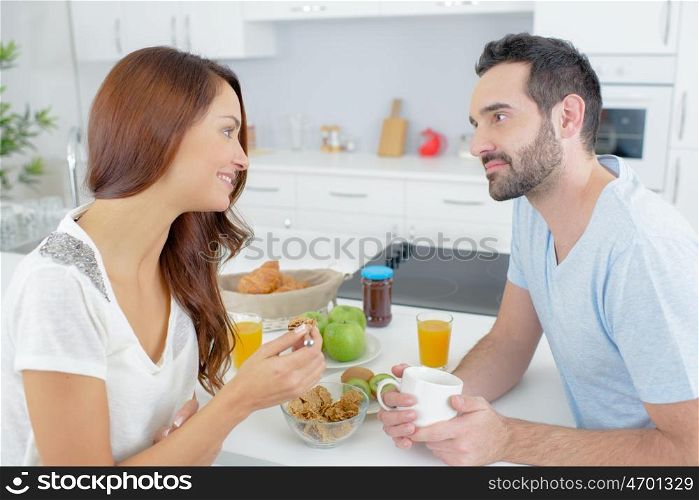 couple having a conversation during breakfast