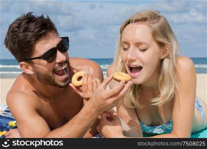couple having a picnic on the beach