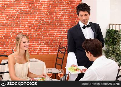 couple having a romantic dinner in a sexy restaurant