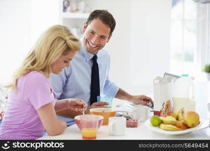 Couple Having Breakfast Before Husband Leaves For Work
