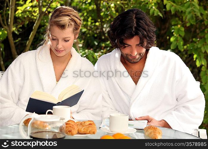 Couple having breakfast outside