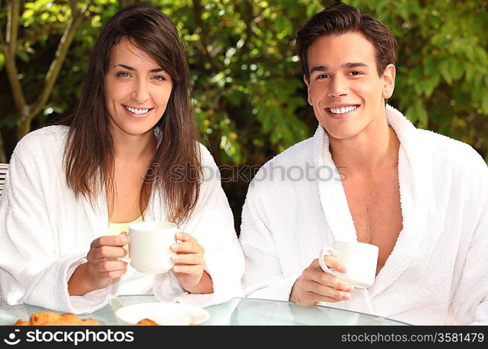 Couple having breakfast outside