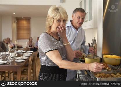Couple Having Difficulty Cooking For A Dinner Party