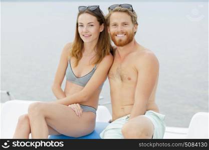 couple having fun in a pedalo boat
