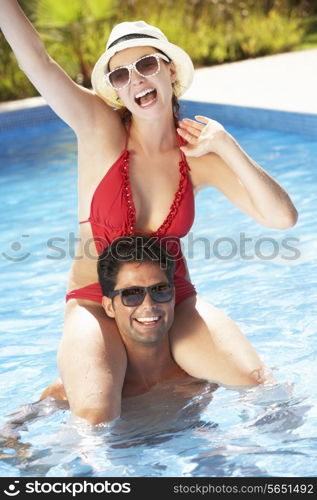 Couple Having Fun In Swimming Pool