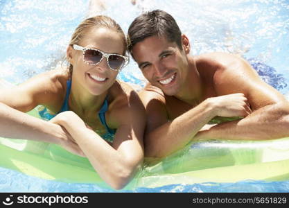 Couple Having Fun In Swimming Pool