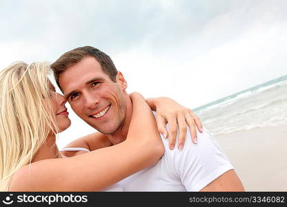 Couple having fun on a sandy beach