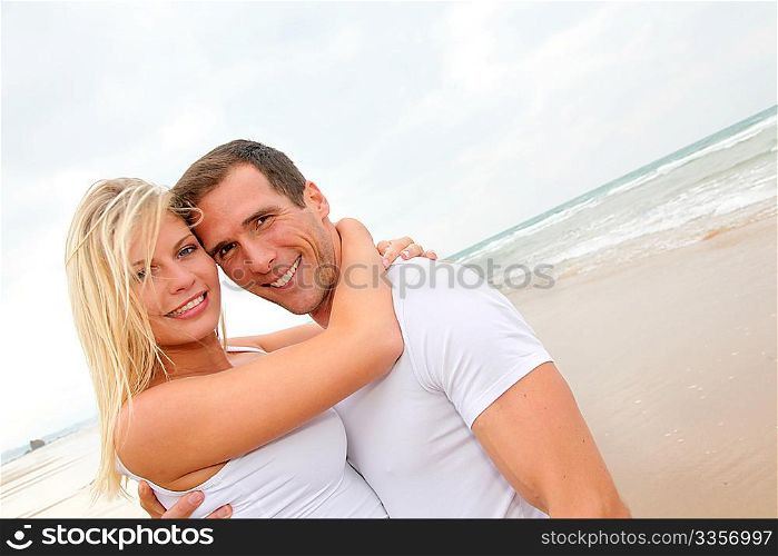 Couple having fun on a sandy beach