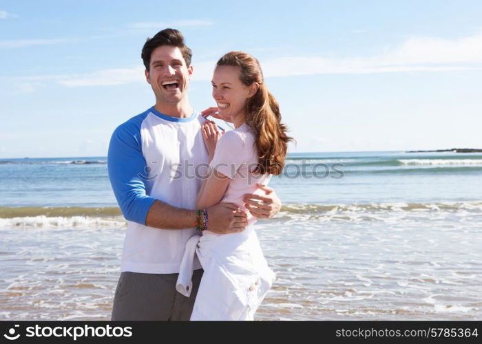 Couple Having Fun On Beach Holiday