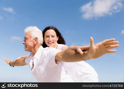 Couple having fun on the beach. We will fly up the sky