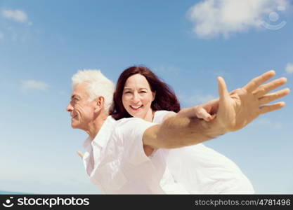 Couple having fun on the beach. We will fly up the sky