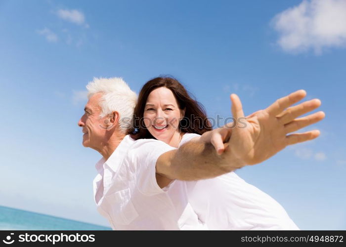 Couple having fun on the beach. We will fly up the sky