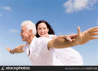 Couple having fun on the beach. We will fly up the sky