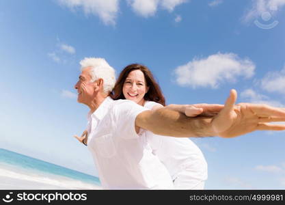 Couple having fun on the beach. We will fly up the sky