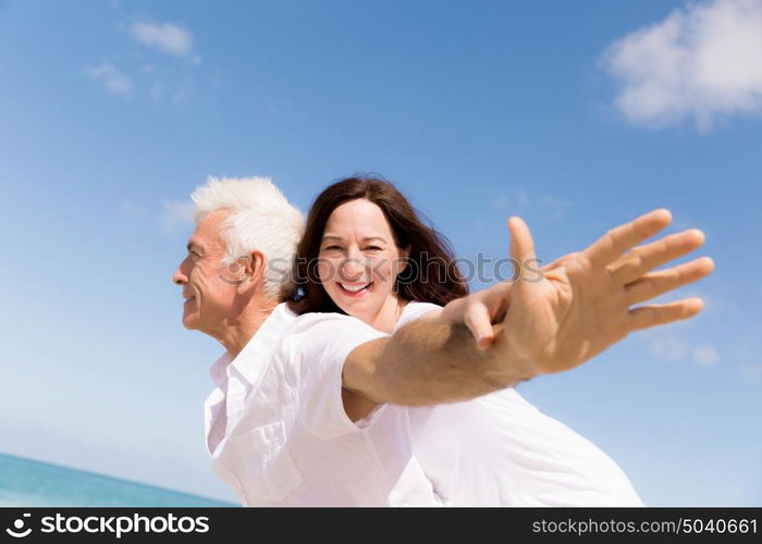 Couple having fun on the beach. We will fly up the sky