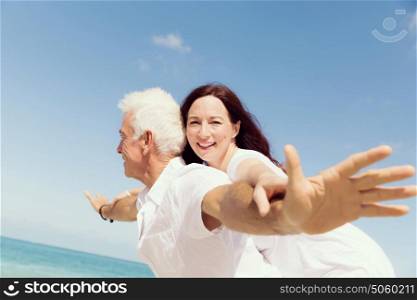 Couple having fun on the beach. We will fly up the sky