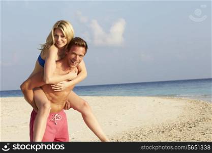 Couple Having Fun On Tropical Beach Holiday