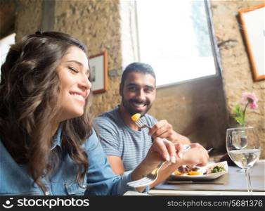 Couple having lunch at rustic gourmet restaurant