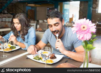 Couple having lunch at rustic gourmet restaurant