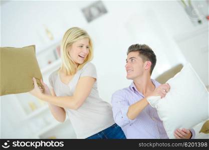 Couple having pillow fight