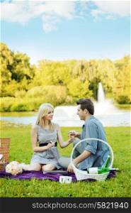 Couple having romantic date in the summer park