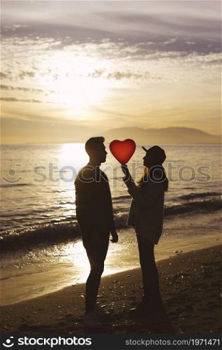 couple heart balloon sea shore evening. High resolution photo. couple heart balloon sea shore evening. High quality photo