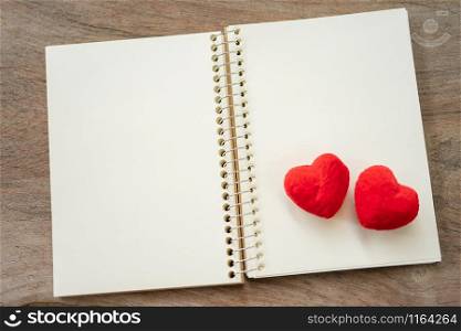 Couple Heart shaped on Note book paper. Day 14 meets Valentine Day. Red heart is the promise of love. using as background Valentine concept with copy spaces for you