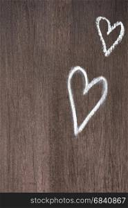 Couple hearts painted on wooden background