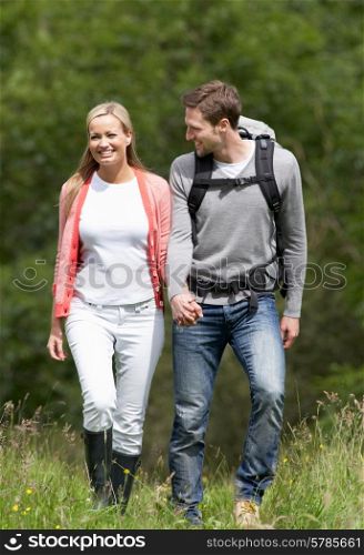 Couple Hiking In Countryside