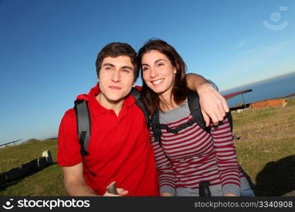 Couple hiking in countryside on beautiful fall day