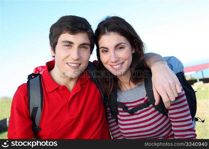 Couple hiking in countryside on beautiful fall day